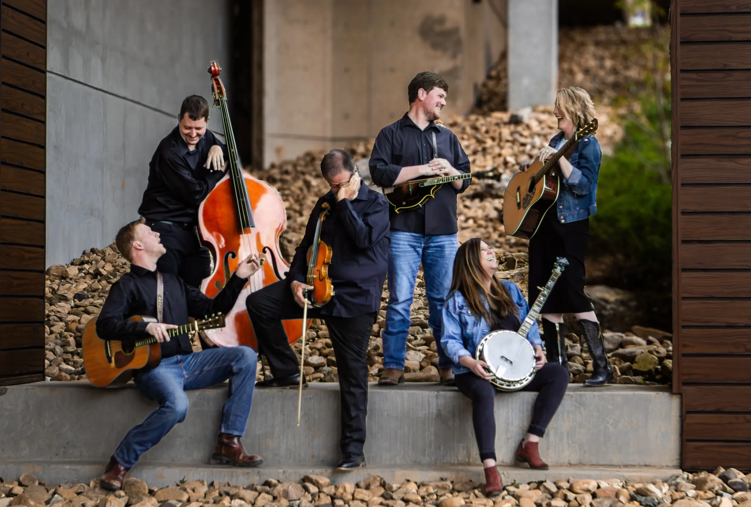 A group of musicians joyfully performing outdoors