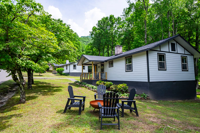 Lovely sunroom/covered deck with plentiful seating and view of the Blue Ridge Mountains.
